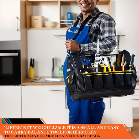 Black tool tote with yellow-trim pockets and metal hardware carried by a worker in blue overalls.