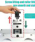 Close-up of Desktop Intaglio Relief Printmaking Press with manual roller and hand crank in operation for embossing.