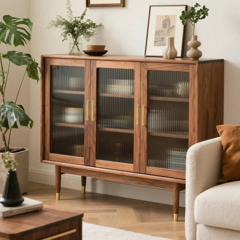 Stylish cabinet with three glass doors, wooden frame, and gold accents, ideal for living room or storage.