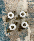 Hella Sturdy Retro Ceramic Cabinet Knobs With Backplate Four Pack Vintage Drawer Pulls Zinc Alloy Kitchen Cupboard Furniture Hardware Quick Swap White Finish For Your Spot displayed on a textured surface.