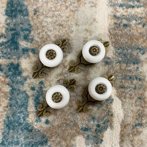 Hella Sturdy Retro Ceramic Cabinet Knobs With Backplate Four Pack Vintage Drawer Pulls Zinc Alloy Kitchen Cupboard Furniture Hardware Quick Swap White Finish For Your Spot displayed on a textured surface.