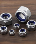 170 Piece Metric Lock Nut Set Nylon Insert Locknuts M3 M4 M5 M6 M8 M10 M12 Stainless Steel Self Locking Nuts on wooden surface