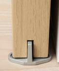 Sliding Barn Door Bottom Floor Guide with T Shape Design, floor mounted on wood, silver finish, installed view