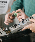 Thirty Piece Black Silicone Cooling Fan Mounting Screws For Pc Computer Case in use, securing a computer frame during installation.