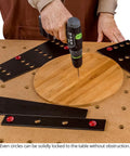 32 Piece Workholding Kit With Dog And Wedge Clamp Holdfast System for MFT tables in use on round wooden piece.