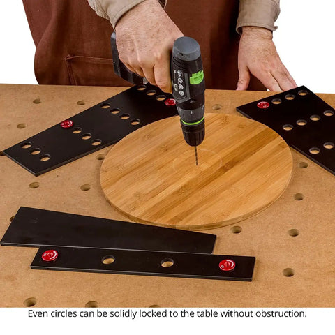 32 Piece Workholding Kit With Dog And Wedge Clamp Holdfast System for MFT tables in use on round wooden piece.
