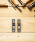 Heavy Duty Stainless Steel Sliding Door Wheels Featuring Double Bearing Pulleys on wood surface with tools.