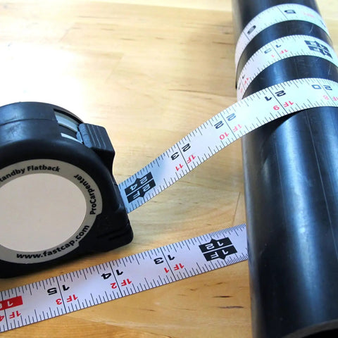 16-Foot Flatback Tape Measure With Left Or Right Readability, Go-To Standby PS-FLAT16 wrapped around cylinder, black casing
