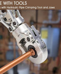 Close-up of Zero Lead Copper Press Fittings One Half Inch Copper Coupling being crimped with hydraulic press tool