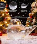 Glass Weather Forecaster Desktop Weather Station Barometer Gift For Women Girlfriend Christmas Birthday Valentine Gift in bird shape on snowy surface with Christmas tree in background.
