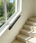 Flush Wall Mount Stair Handrail Heavy Duty Stainless Steel Safety Rail Sleek Modern Black Profile installed on stairs.