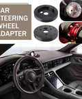 Slick Hardcore Street Ready Six To Three Hole Steering Wheel Adapter With Quick Release Hub and rugged locking bolts displayed in a car interior.