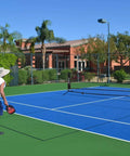 Players using the All In One Portable Pickleball And Tennis Practice Net System No Tools Easy Setup In Minutes Freestanding 10ft Net
