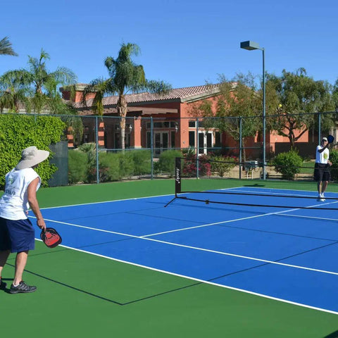 Players using the All In One Portable Pickleball And Tennis Practice Net System No Tools Easy Setup In Minutes Freestanding 10ft Net