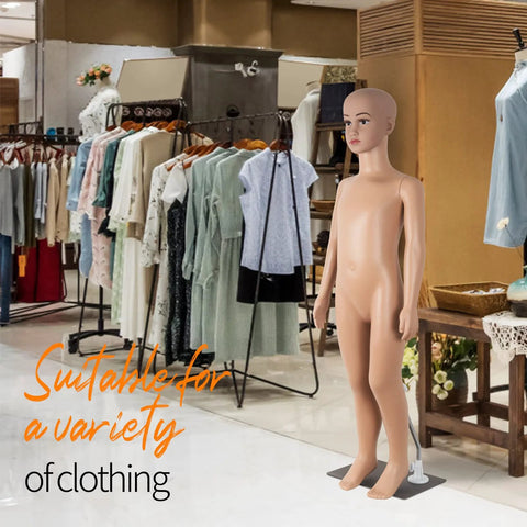 Child-sized full-body mannequin with bald head on metal base in clothing store display.