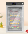 Heavy Duty Commercial Food Dehydrator With 16 Stainless Steel Trays, showing food items inside and digital control panel.