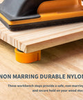 Heavy Duty Three Quarter Inch Aluminum Workbench Dogs Eight Pack With Grippy Pads on a workbench holding wooden stock securely.