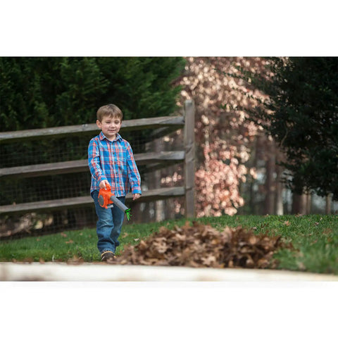 Child using 125B Toy Leaf Blower For Kids That Actually Blows Air And Lights Up, Totally Realistic Mini Tool For Toddlers And Up outdoors