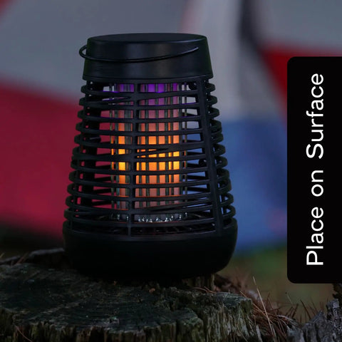 Solar Powered Bug Zapper Outdoor Insect Trap With 600V Grid, LED Flickering Flame, auto activates at dark, on a stump