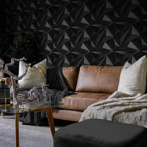 Living room with Black Diamond PVC 3D Wall Panel Set For Interior Decor Large 19 7 By 19 7 Inch Textured Diamond Panels Pack Of 12 Tiles Quick Install Dope Modern Black Wall Accent For Living Rooms And Offices behind a brown leather sofa.