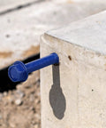 200 Piece Blue Hex Concrete Screw Anchors 1/4 X 3-1/4 Inch PTFE Carbon Steel Masonry Bolts installed in concrete block.