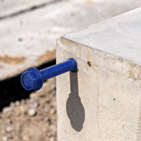 200 Piece Blue Hex Concrete Screw Anchors 1/4 X 3-1/4 Inch PTFE Carbon Steel Masonry Bolts installed in concrete block.