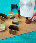 Leather Corner Punch Set With 18 Pieces In 6 Sizes And 3 Shapes, Pro Grade High Carbon Steel Corner Cutters in use on leather mat