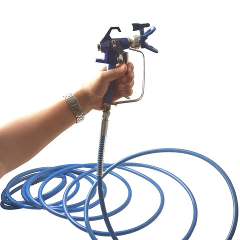 Hand holding a paint spray gun connected to a Badass 50 Foot Airless Paint Spray Hose Built Like A Tank For 8500 Psi High Pressure Handling.