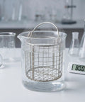 Stainless Steel Ultrasonic Cleaner Basket With Fine Mesh And Swinging Handle Fits Standard Tanks submerged in water at 80°C.
