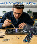 Person soldering components on a circuit board, featuring the Straight Up DIY Flight Simulator Soldering Kit With Interactive LCD Display.