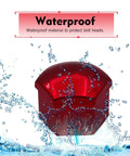 Close-up of red premium PP plastic 21mm lug nut cover with water splash, showcasing waterproof feature and hexagonal design.