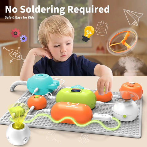 Child exploring STEM Electronics Kit For Kids With 31 Circuit Parts And 300 Plus Projects No Soldering Needed on grey mat