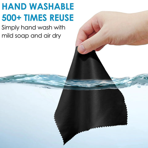 Front view of black microfiber cleaning cloth, 7 x 6 inches, being wrung by hand over water.