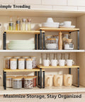 Premium Bamboo Kitchen Counter Shelf Set Of Two Stackable Expandable Spice Rack Storage Holder For Jars Cookbooks Tools in a cabinet.