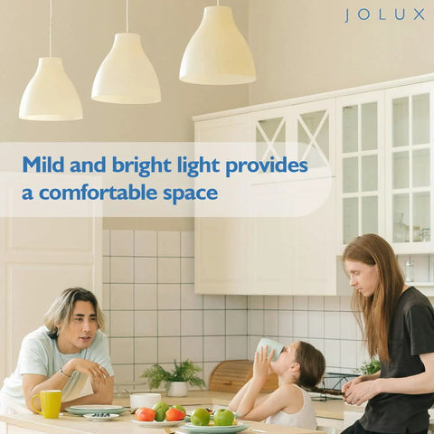 Family enjoying bright kitchen illuminated by pendant lights