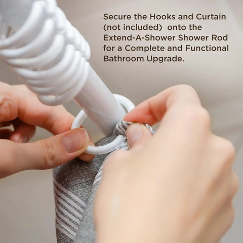 Hands securing curtain rings on Extend A Shower RV Rod Hinged Folding Adjustable Shower Curtain Rod For RV And Camper Bathrooms Space Saving Satin Finish Fits 35 To 40 Inch Openings Included.