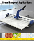 Heavy-Duty Manual Tile Cutter 31 Inch For Ceramic And Porcelain Tiles With Tungsten Blade and Rail Guides shown cutting a large tile.