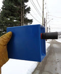 Blue Hard Hat Lineman Bucket Tray With Slick Patented Ramp And Magnetic Holder For Bucket Truck Lip Mount held outdoors.