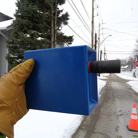Blue Hard Hat Lineman Bucket Tray With Slick Patented Ramp And Magnetic Holder For Bucket Truck Lip Mount held outdoors.