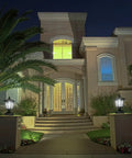 Night view of house entrance with Outdoor Solar Powered Post Cap Lights For 4x4 Wood Posts, Classic Lantern Style on pillars.