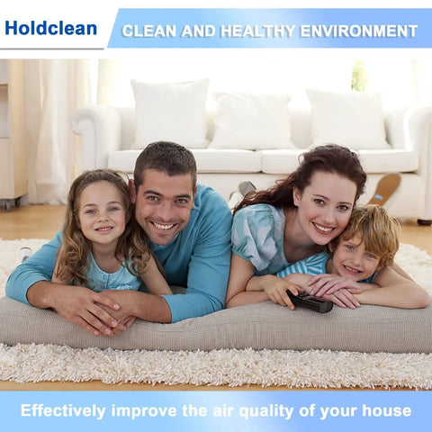 Happy family in living room representing clean air environment by Holdclean