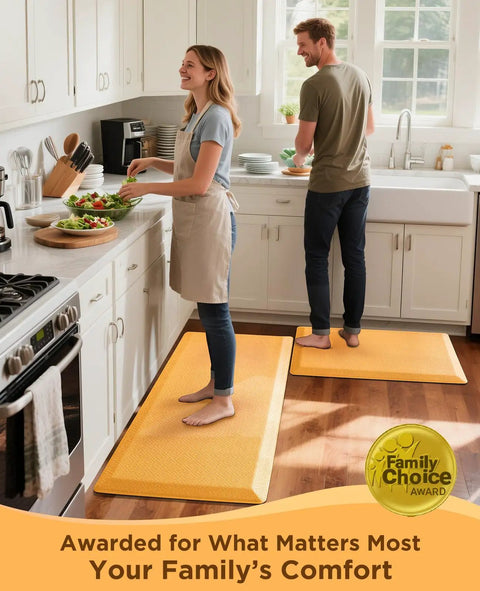 Two people using Anti Fatigue Kitchen Mat Cushioned 0.75 Inch Thick Standing Pad For Kitchen Office And Sink 20 By 32 Inches Waterproof Ergonomic Comfort Non Slip Bottom Bright Orange Easy To Clean in a kitchen.