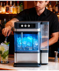 Heavy Duty Countertop Nugget Ice Maker Spits Out Chewable Ice Fast With Built In Water Tank And Hassle Free Self Clean Feature, filling a glass.