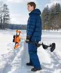 Person holding Beast Mode 40V Electric Ice Auger With 8 Inch Diameter For Ice Fishing, standing in snowy landscape.