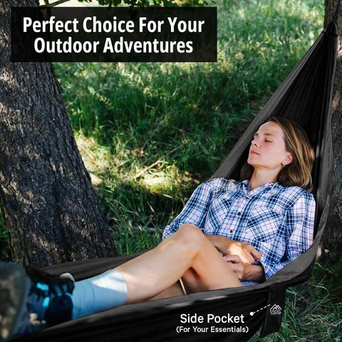Person relaxing in Durable Nylon Camping Hammock For Outdoors, Ultra Portable Tree Hammock under trees