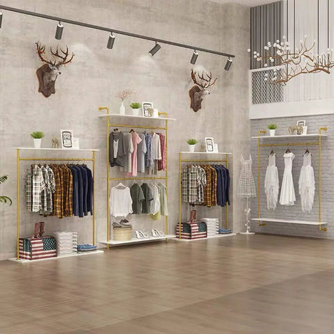 Hella Sturdy Two Tier Industrial Garment Rack With Thick Wood Shelf And Durable Metal Frame Wall Mounted showcasing clothes storage in an elegant boutique.