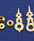 Cuckoo Clock Hands Replacement Kit for Regula Movements, cream plastic hands and brass nuts on blue background.