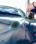 35 Piece Sanding Disc Polishing Kit With Handle Aluminum Oxide Abrasive Wheels and Pro Grade High Hardness Resin Backing for Rust Busting shown polishing a car surface.