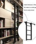 Black Sliding Barn Door Ladder Kit With Retractable Full Track Set for home indoor loft use, showing folded ladder against bookshelf