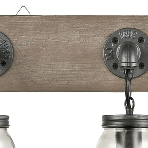 Close-up of Farmhouse Style 3-Light Mason Jar Wall Sconce with Wood Base and Glass Shades for Indoor Bathroom Vanity Lighting